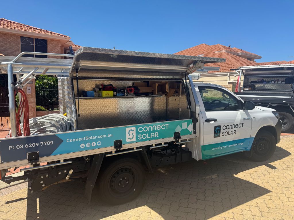 Connect Solar cars on site conducting a solar installation